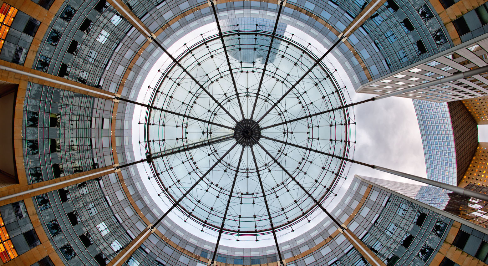 View of sky from in building and below 