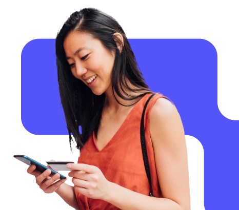 Woman using her banking card with her mobile device.