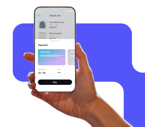 A person is holding a mobile phone showing their credit card payment.